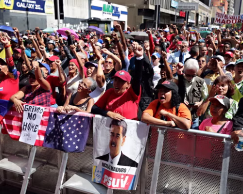 Chavistas march in Caracas on Sunday to protest against the capture of President Maduro. Photograph: Ronald Pena R/EPA